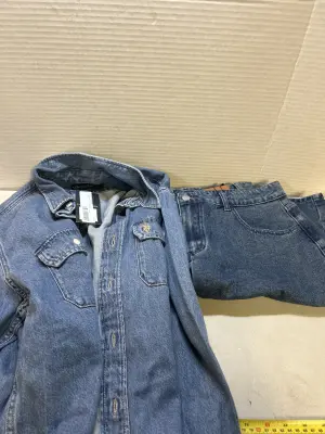 large jean shorts and polo shirt