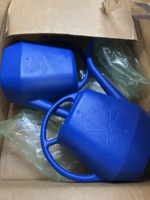 two small watering cans