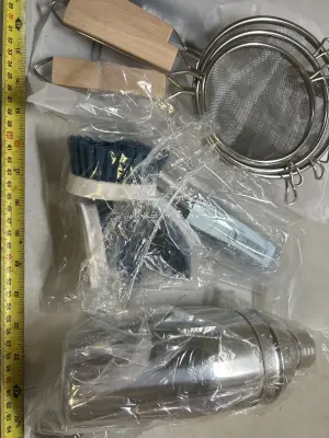 cocktail shaker with spoon, mesh strainer, dish soap, brushes