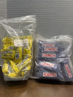 lot of banana laffy taffy and lot of mini crunch bars