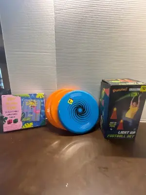 light up football set, 3 frisbies, inflatable corn hole set