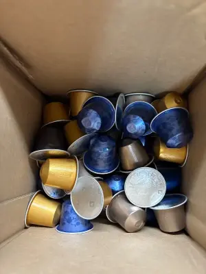 Box of various nespresso pods
