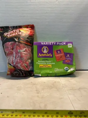 lot of 100grand bars and 22 pouches of annies fruit snacks