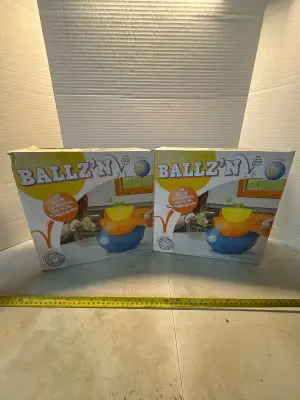 Stacking bowls winning tube lid teal balls