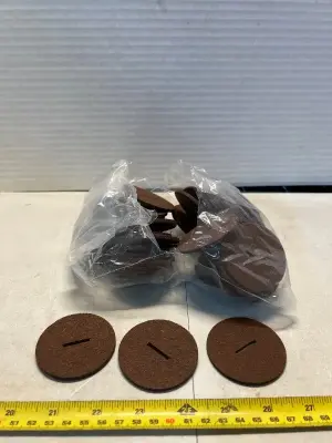 lot of brown felt sliders for furniture