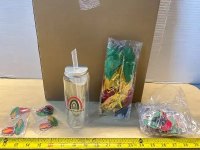 Box of “Happy kwanza” bottles and keychains