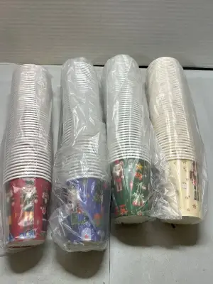 lot of christmas patterned disposable cups
