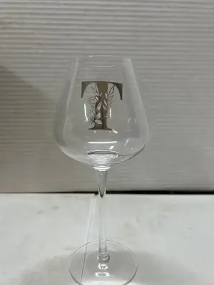 wine glass with the letter T
