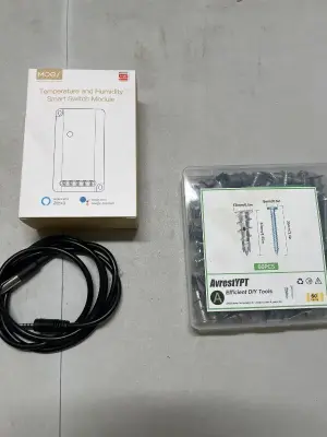 temperature and humidity smart switch module, assorted screws, and a power  cord