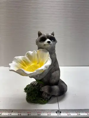 Raccoon garden decor