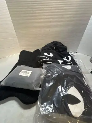 2 bone shaped pet stockings and 2 adult kitty halloween cloaks