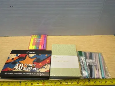 Markers, pens, and notebooks