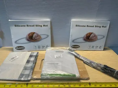 Silicone bread slicing mats (2), cutting board’s(2),icing spatulas (3) and tablecloth