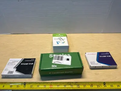 Box of staples ,stamp pads (2) and waterproof cable connecter covers