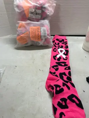 lot of breast cancer aware ness socks for football