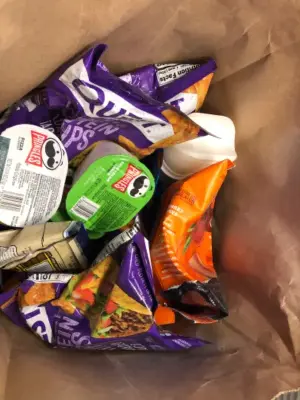 Paper bag of assorted snacks
