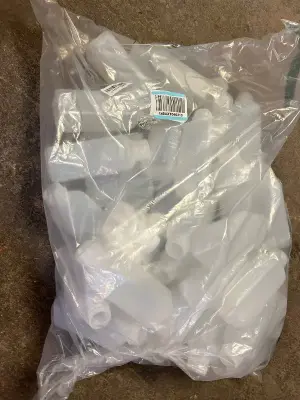 bag of plastic bottles with lids