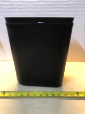 2 small black trash cans