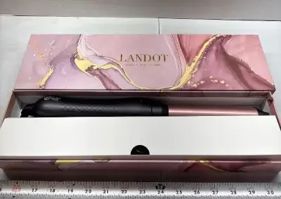 Spinning curling wand