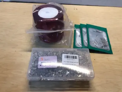 Two spools of ribbons, 2 containers 200 pc flat head tacks, 3 sewing machine parts