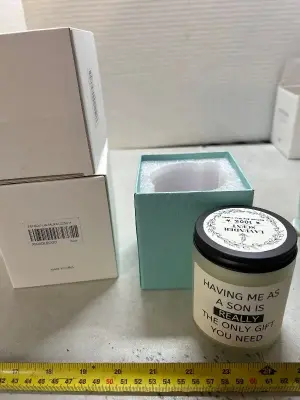 three lavender scented candles that come with gift boxes and funny phrase