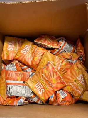 big box of cheddar sun chips (mostly in date)