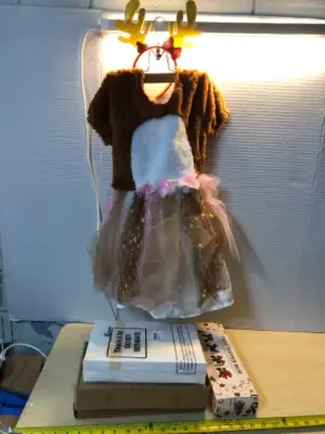 Child’s reindeer costume, tree topper bow, Christmas plush toy