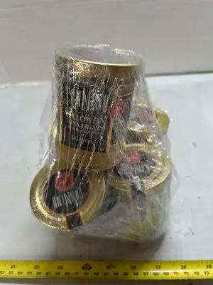 five jars of yellowfin tuna fillets with black pepper in olive oil