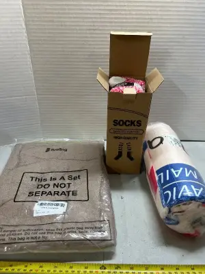 three-piece Christmas tree skirt, one box of women’s fuzzy socks, and one Mother’s Day blanket