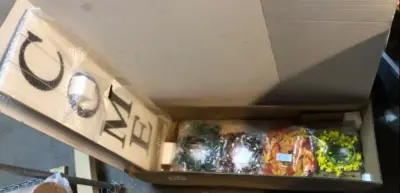 Wooden welcome sign with wreath decoration