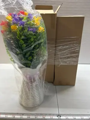 two faux flower centerpieces with weighted beads