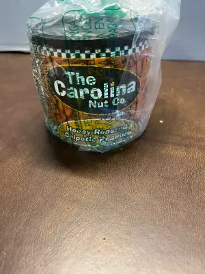 The Carolina nut honey roasted chipotle peanuts 12 OZ EXP 12/17/2025