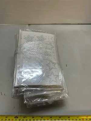 A lot of sheets of sticky faux diamonds