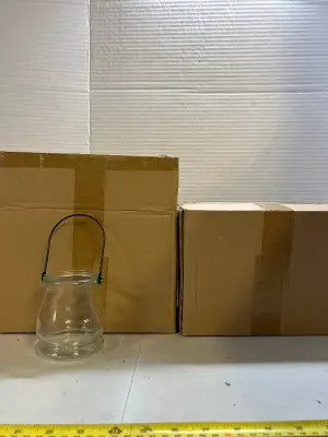 two boxes of little glasses with handles