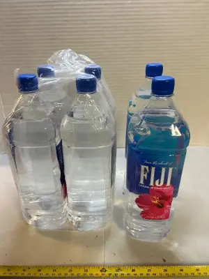 6 1.5 liter bottles of Fiji water