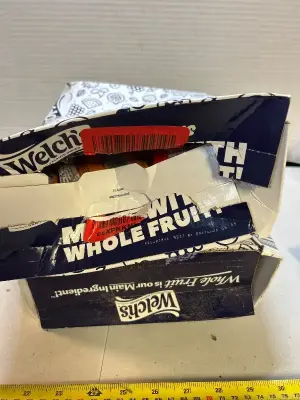 two boxes of assorted flavored Welches fruit, snacks, and yogurt