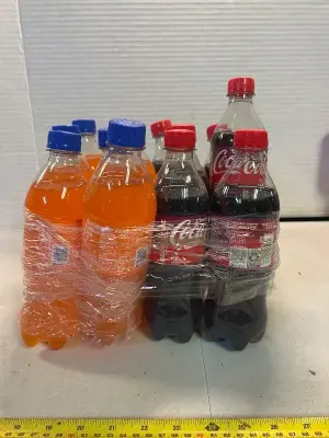 12 bottles of Fanta and cherry Coke, mostly out of date