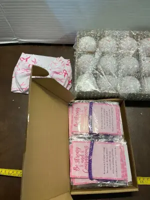 cancer bow , box of bow ornaments, and bracelets