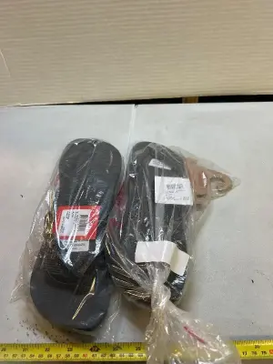 two pairs of black flip-flops size 9/10 in women’s