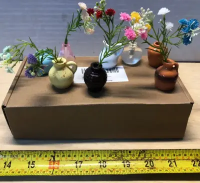 4 boxes of mini magnet vases