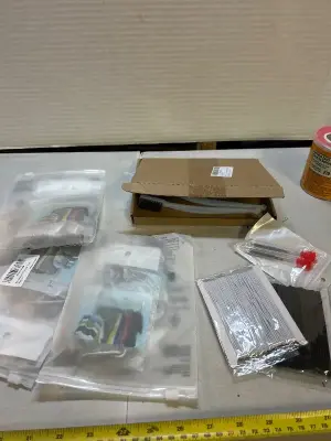 three count clothes, hangers, lots of metal wire brushes, sewing needles and two bracelet making elastic