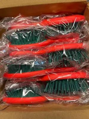 box of tiny hairbrush’s