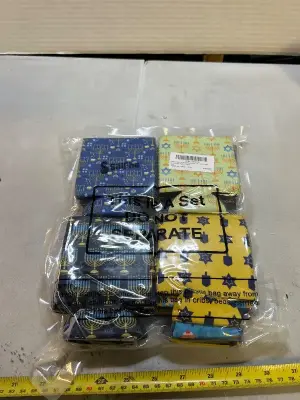 A lot of Hanukkah themed can couzies