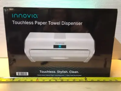 Touch less paper towel dispenser