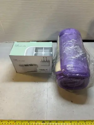 padded purple, floor mat and large toothbrush caddy