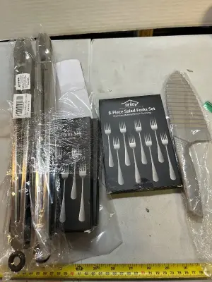 two sets of long tongs, patterned knife, three 8 piece sets of salad forks