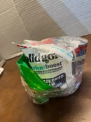 variety dog treats & can of wet food