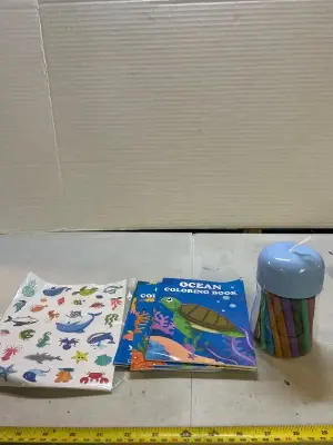 A lot of mini coloring books, stickers, and crayons