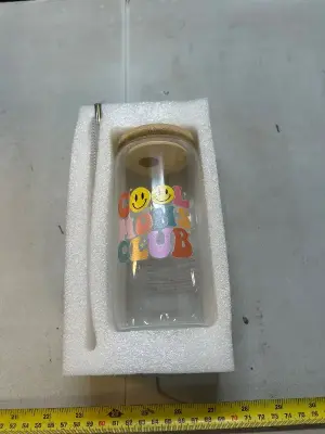 glass cup with straw and cleaning tool