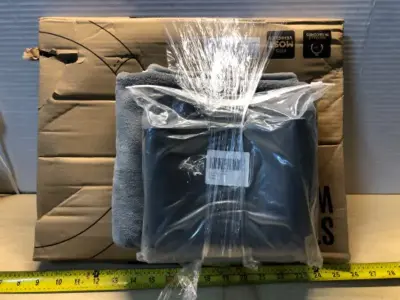 Beige steering wheel cover, silicone stove cover, grey drying mat